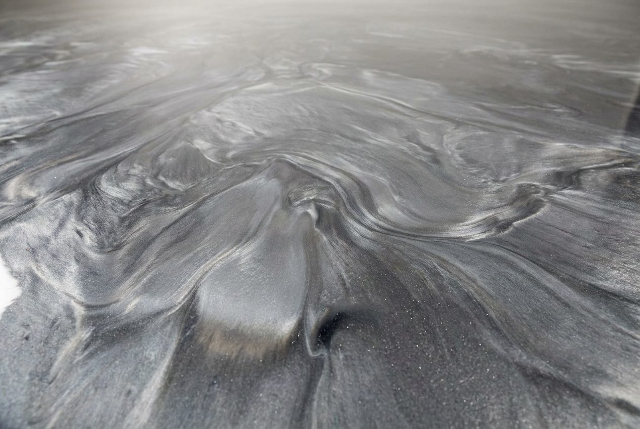 Pearlescent metallic epoxy floor with a deep marbled gloss